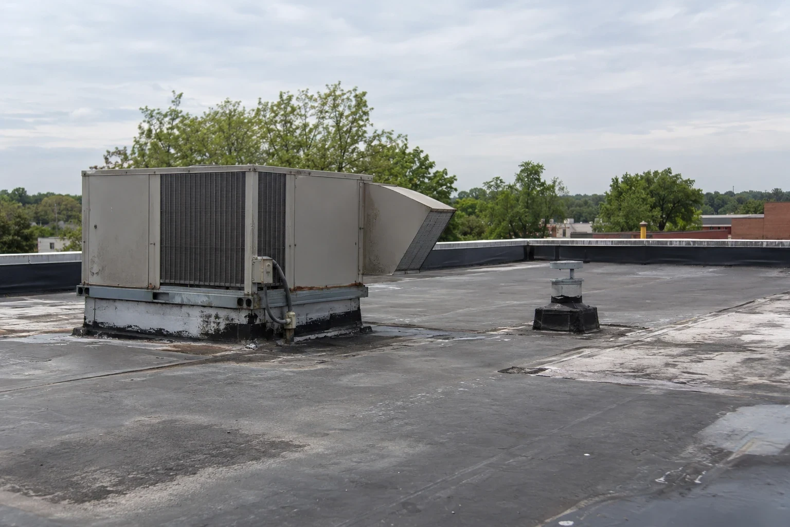 Occupied-Building Commercial Reroofing in Bryan, TX